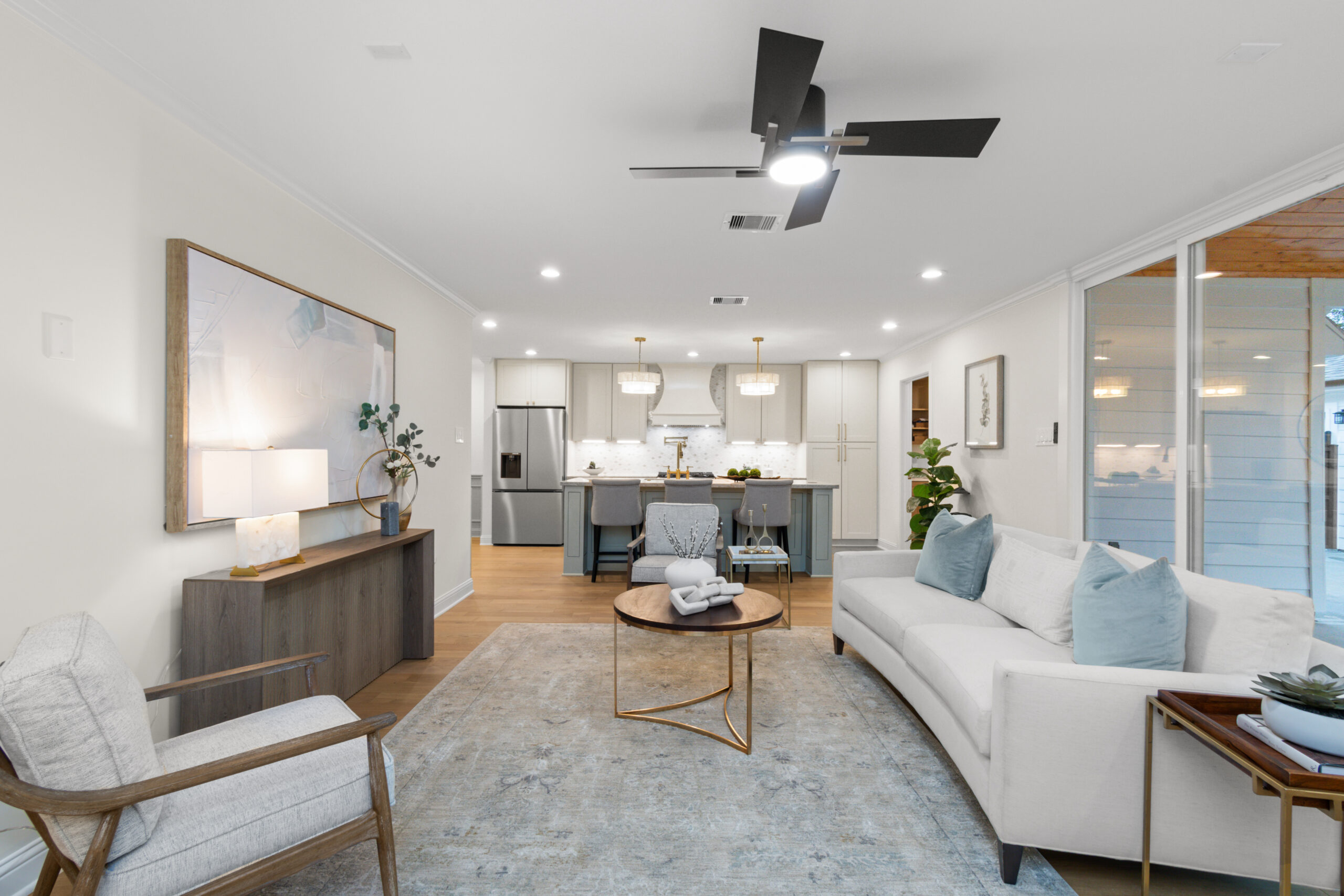 Open living room into kitchen — whole home remodel by Vega Flooring, Houston TX