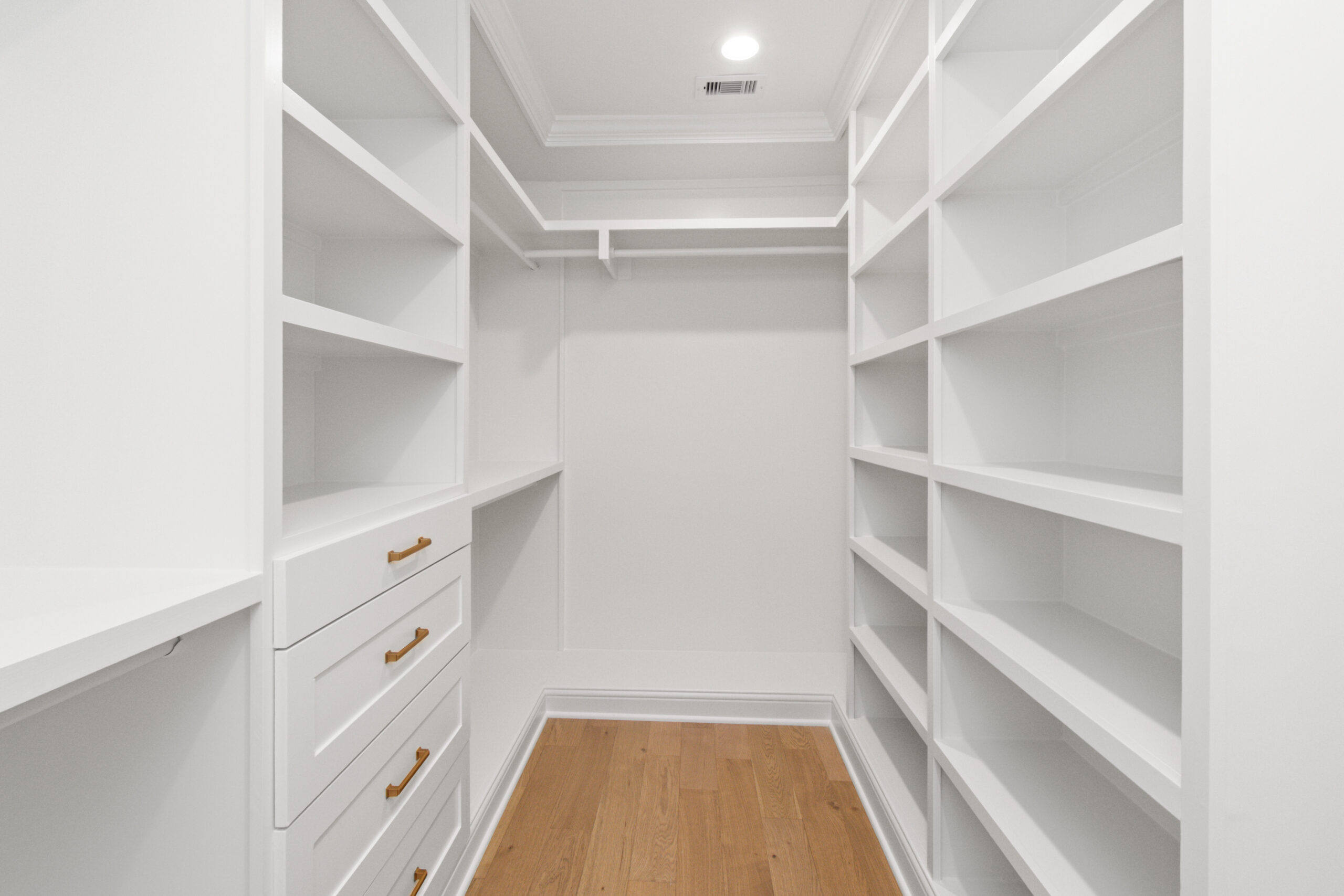Custom master closet built-ins by Vega Flooring, Houston TX